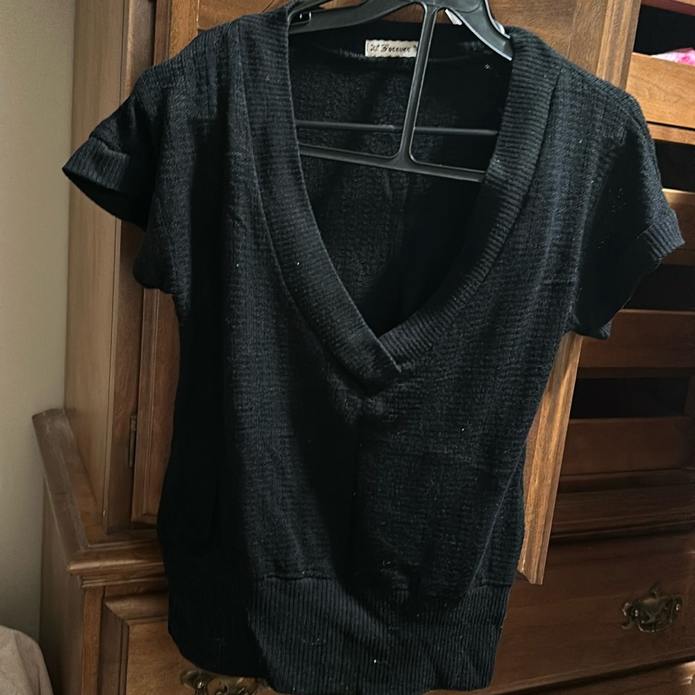 Super cute pair forever 21 black shirt and jeans skirt.